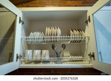 Cutlery Storage Cabinet With Open Door, White Plates, Mugs And Cups, From The Front View