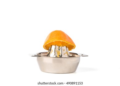 Cutout Of Half An Orange On A Stainless Steel Hand Juicer