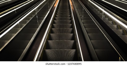 Cutout Of Multiple Escalators In A Train Station