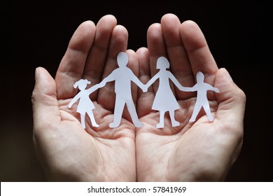 Cutout Paper Chain Family With The Protection Of Cupped Hands, Concept For Security And Care