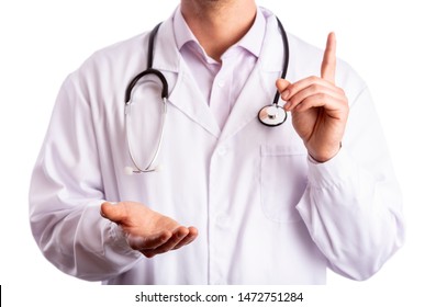 Cutout Of Unrecognizable Young Male Doctor In White Lab Coat With Stethoscope Raising Index Finger In A Gesture Of Caution. Copy Space. Isolated On White Background. Open Palm Of Hand. Close-up.