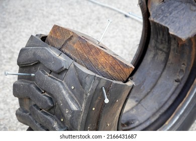 Cut-out View Of Run Flat Tire With Sticking Screw.