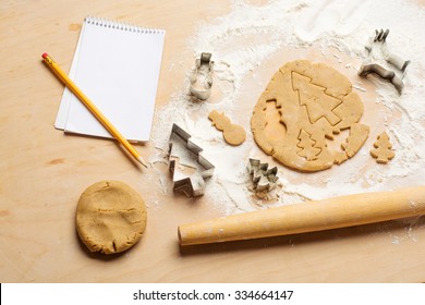 cutouts of cookie dough on the wooden board