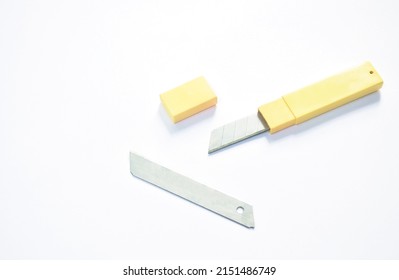 Cutter Blade In Yellow Box Package On White Background