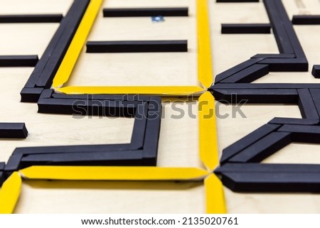 Cutter form - polygraph industry for cutting and folding paper in complex shapes with yellow tapes