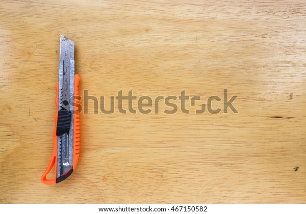 Cutter Knife On Wooden Floor Stock Photo Edit Now 467150582