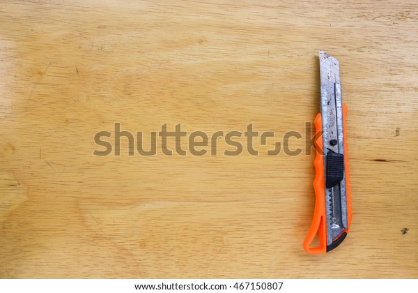 Cutter Knife On Wooden Floor Stock Photo Edit Now 467150807