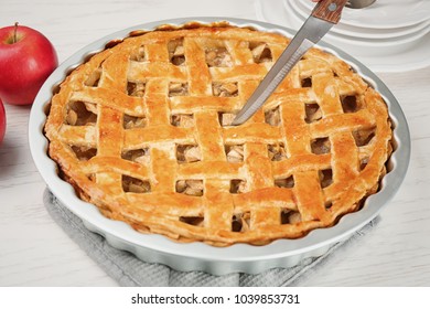 Cutting American Apple Pie On Table