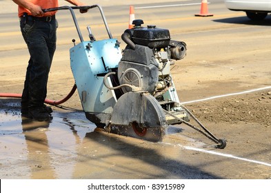 Cutting asphalt road to repair a 12 inch water main failure on Harvard Ave in Roseburg OR