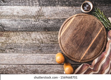 Cutting board for cooking with spices and herbs. Top view of round cutting board with copy space. - Powered by Shutterstock
