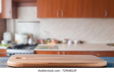 cutting board on the kitchen table - Shutterstock ID 729048139
