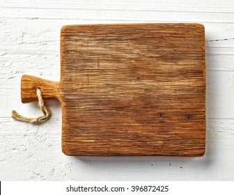 Cutting Board On White Wooden Table, Top View