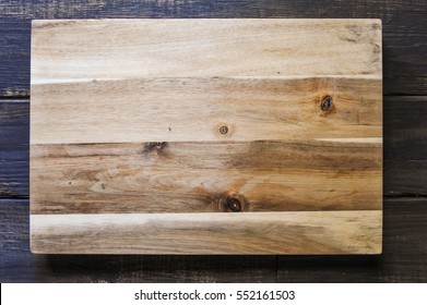 Cutting Board On Wood Background