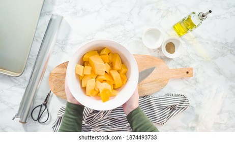 Cutting Butternut Squash On A Wood Cutting Board.