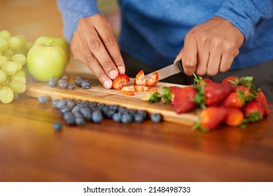 Cutting Calories Out Of His Diet. Cropped Shot Of A Man Preparing A Healthy And Fruity Snack.