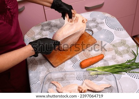 Cutting up a chicken carcass