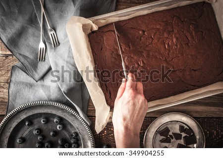 Cutting chocolate brownie  top view