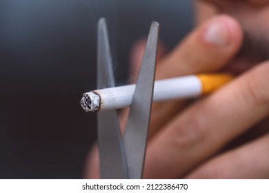 Cutting Cigarette With Scissors. Stop Smoking, Quit Smoking Or No Smoking Concept. Refusing Tobacco And Quit Bad Habit