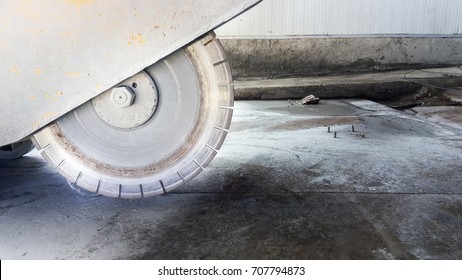 cutting concrete floor with diamond saw blade machine