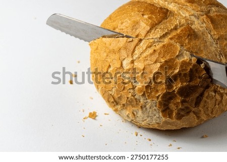 Cutting Crusty Bread With Knife