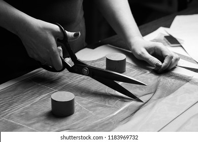 Cutting Up The Fabric With Tailor Scissors For Further Bespoke Exclusive Fashioning. Tailor Atelier - Handmade Exclusive Clothes Making And Repair, Private Business, Creative Occupation Concept