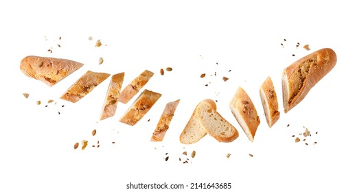 Cutting Fresh Baked Loaf Wheat Baguette Bread  With Crumbs And Seeds Flying Isolated On White Background. Healthy Food.