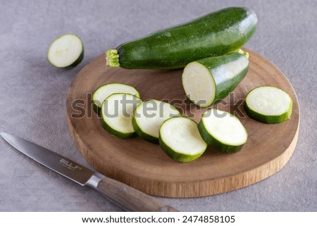 Cutting fresh and delicious zucchini