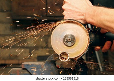 Cutting Metal With Angle Grinder, Sparks From The Disk