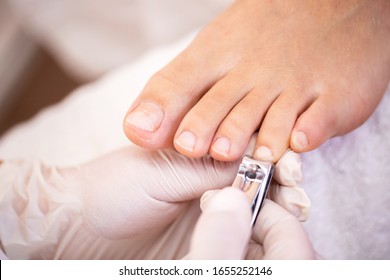 Cutting Nails From Fourth Toe With Nail Clippers, Pedicure Concept