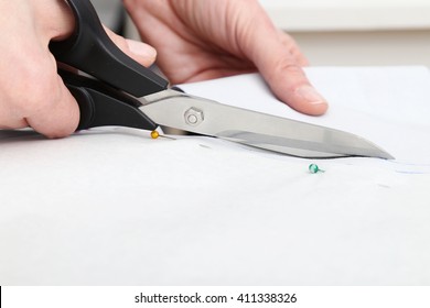 Cutting paper model with scissors 