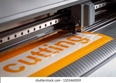 Cutting plotter close-up. The process of cutting a vinyl film. - Shutterstock ID 1101465059