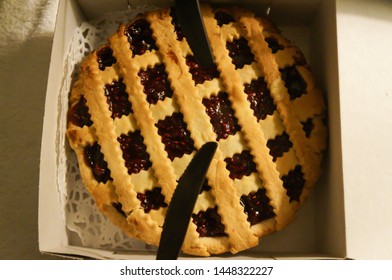 Cutting raspberry pie in box
                               