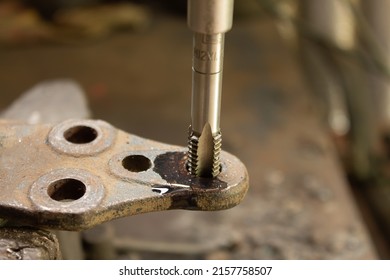 Cutting A Thread In A Hole With A Tap By Hand. Material High Speed Steel. We Make An Internal Thread.