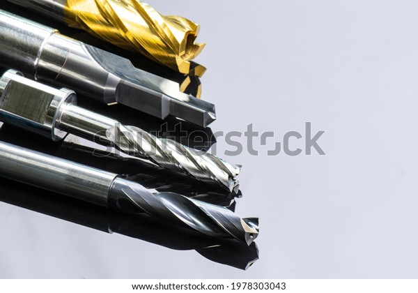 cutting tools special set. Drill, endmill,\
reamer, burnishing. spiral right hand. material Carbide and high\
speed steel, coating Titanium nitride. for steel, aluminium.\
isolated on back\
background.