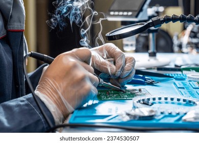 Cutting-edge electronics workshop scene showcases a skilled technician's hands meticulously soldering on a modern circuit board. Smoke rises, tech-focused emphasizing precision and high-tech expertise