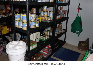 Cuyahoga Falls, OH/USA - 02 28 2020: Prepper Shelves Basement Black Buckets Of Food Ready For Quarantine Or Disaster