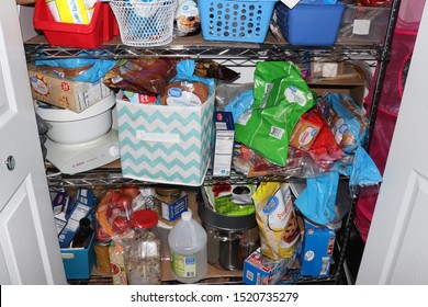 Cuyahoga Falls, OH/USA - October 1, 2019: Food Pantry Close Up Of A Messy Prepper Pantry