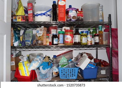 Cuyahoga Falls, OH/USA - October 1, 2019: Messy Prepper Pantry Full Of Too Much Junk Food