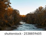 Cuyahoga River running through Cuyahoga Valley Ohio, River running through a forrest of peak foliage, River in the Autumn