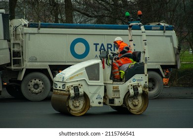 Cwmbran, Wales, UK - 01.28.2022: A Construction Worker Is Driving A Tarmac Roller.