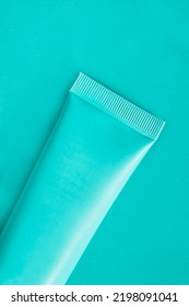 Cyan Color Blank Toothpaste Tube Closeup On Cyan Background