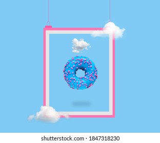 Cyan Doughnut On A Bright Light Blue Background And Pink Frame. Minimalistic Food Art 