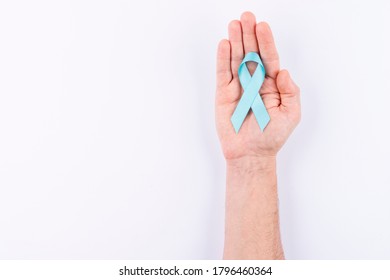 Cyan Ribbon Over Palm. White Background.