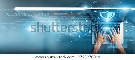 Cyber analyst using a laptop with cybersecurity data threat detection, network monitoring, encryption standards, vulnerability assessments, incident response, and compliance reporting.