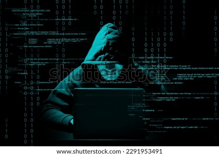 Cyber attack. Anonymous hacker working with laptop on black background. Different digital codes around him