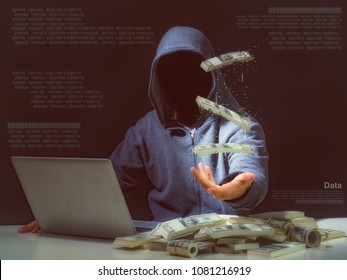 Cyber Attack With Unrecognizable Hooded Hacker.Hacker Steal Money In The Office.