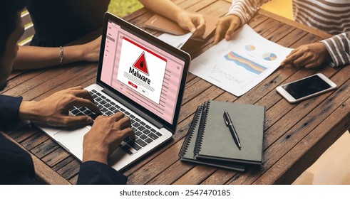 Cyber attacking concept. Malware alert showing on computer screen display scam and threat detection on computer system or online server to be removed snugly.