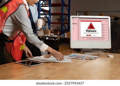 Cyber attacking concept. Malware alert showing on computer screen display scam and threat detection on computer system or online server to be removed snugly.