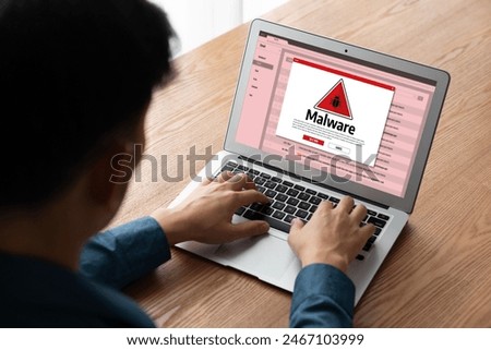 Cyber attacking concept. Malware alert showing on computer screen display scam and threat detection on computer system or online server to be removed snugly.