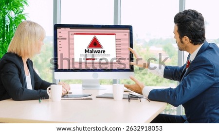 Cyber attacking concept. Malware alert showing on computer screen display scam and threat detection on computer system or online server to be removed snugly.